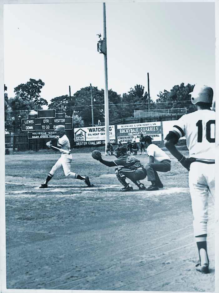 Edmead swinging away, as Cruz waits on deck.